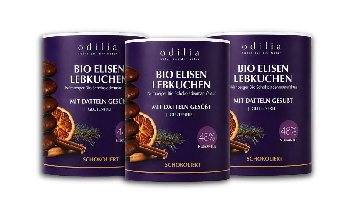 Drei Dosen Odilia Bio Elisen Lebkuchen mit Schokolade überzogen.