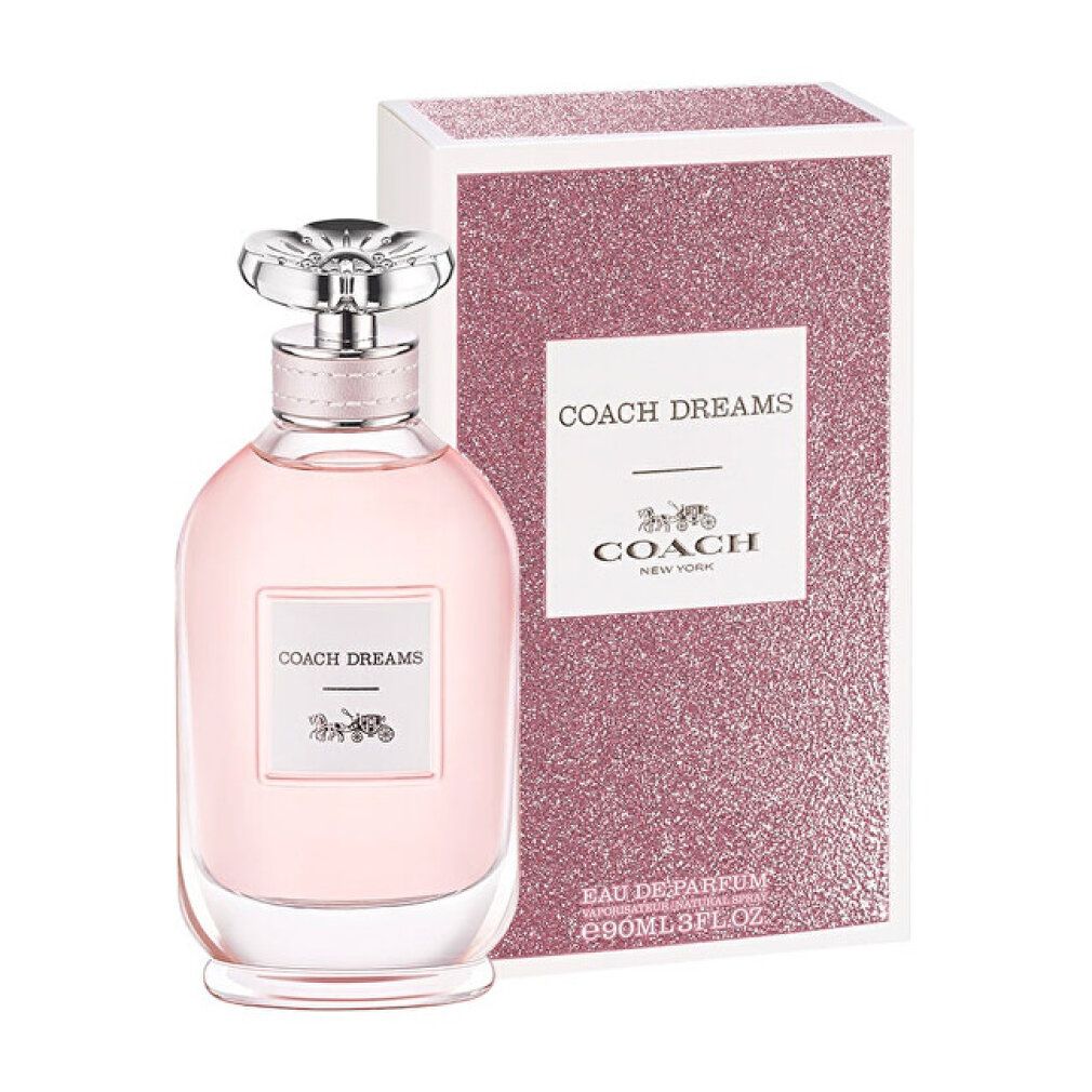 Rosa Glasflakon mit silbernem Deckel und Verpackung. Aufschrift "COACH DREAMS" und Kutschenlogo. Glitzernde Verpackung.