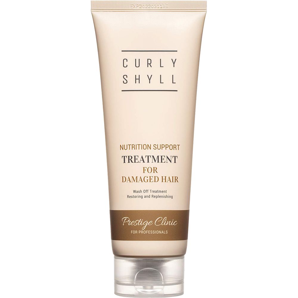 Beige Tube mit schwarzer Schrift. Aufschrift: CURLY SHYLL, Nutrition Support Treatment for Damaged Hair, Prestige Clinic.