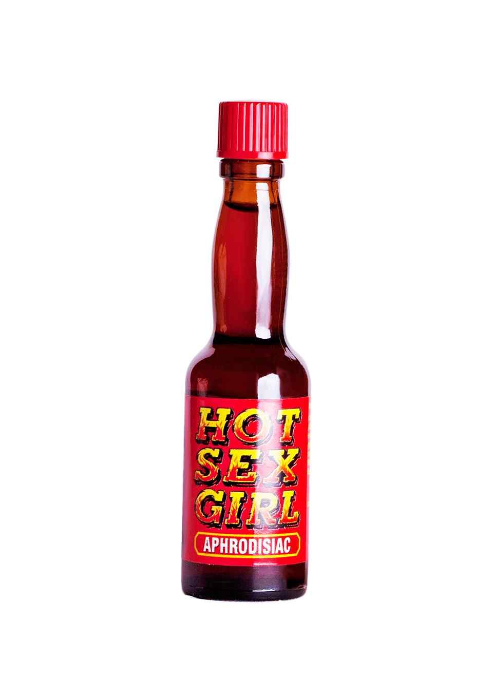 Kleine Flasche mit roter Kappe und Etikett. Aufschrift: HOT SEX GIRL, APHRODISIAC.