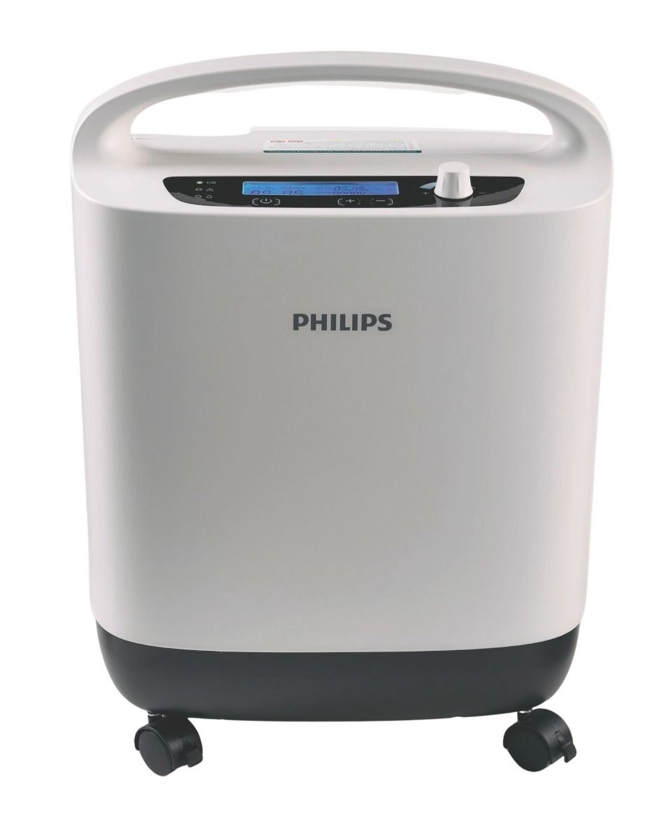 Weißer Sauerstoffkonzentrator mit schwarzem Sockel und Rädern. Philips-Logo oben.