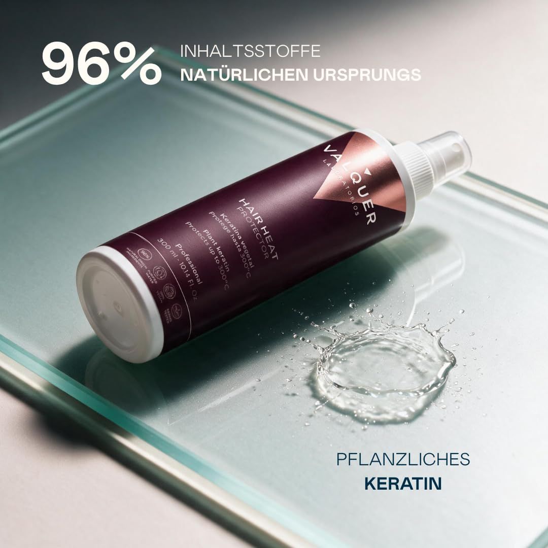 Dunkelroter Pumpsprühflakon von Valquer mit Aufschrift "Hair Heat Protector" und "Pflanzliches Keratin".