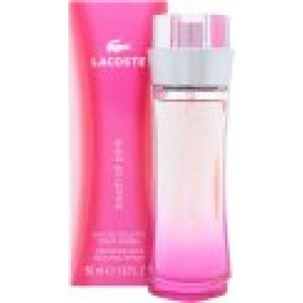 Lacoste Touch of Pink Eau de Toilette Flakon und Verpackung. Rosa Farbverlauf auf Flasche und Karton.