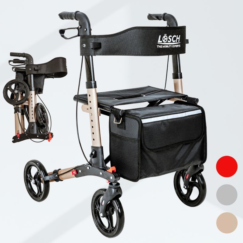 Rollator, teilweise zusammengeklappt. Schwarzer Sitz und Tasche. Drei Farboptionen: Champagner, Rot, Silber.