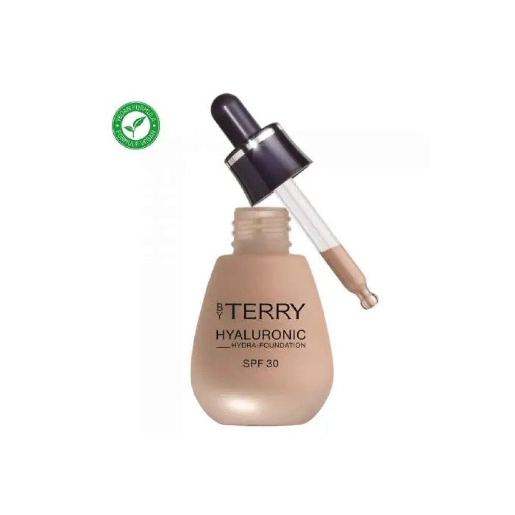 Foundation-Flakon mit Pipette. Aufschrift: BY TERRY HYALURONIC HYDRA-FOUNDATION SPF 30. Grünes Logo. Beige Farbton.