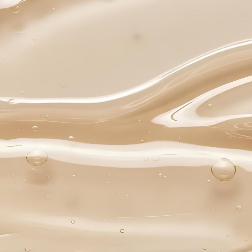 Nahaufnahme einer transparenten, gelblichen Geltextur mit Bläschen. Wellenförmige Bewegung.