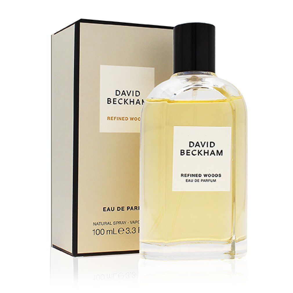 Parfümflasche und Verpackung. Auf der Flasche: "DAVID BECKHAM REFINED WOODS EAU DE PARFUM". Auf der Verpackung: "DAVID BECKHAM".