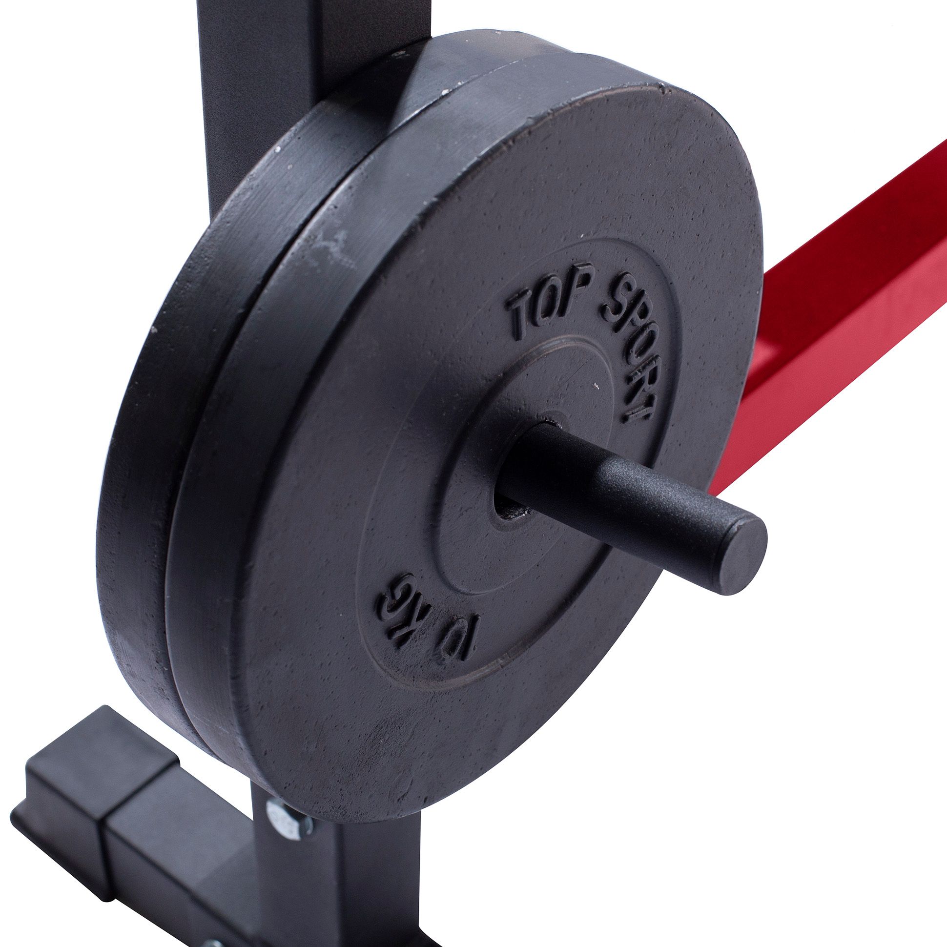 Nahaufnahme einer schwarzen Hantelscheibe mit der Aufschrift 'TOP SPORT' und '10 KG'.