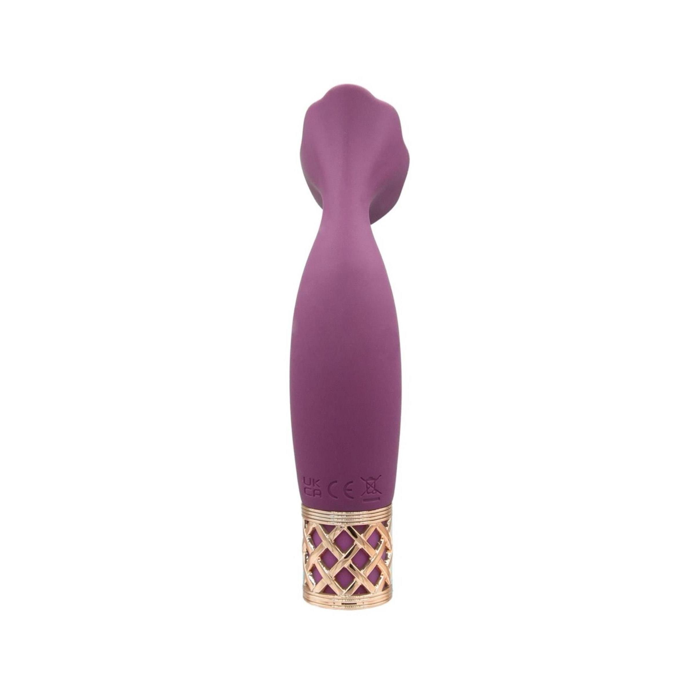 Lila Vibrator mit goldfarbenem Gittermuster am Griff. Oben ein blütenförmiger Aufsatz.