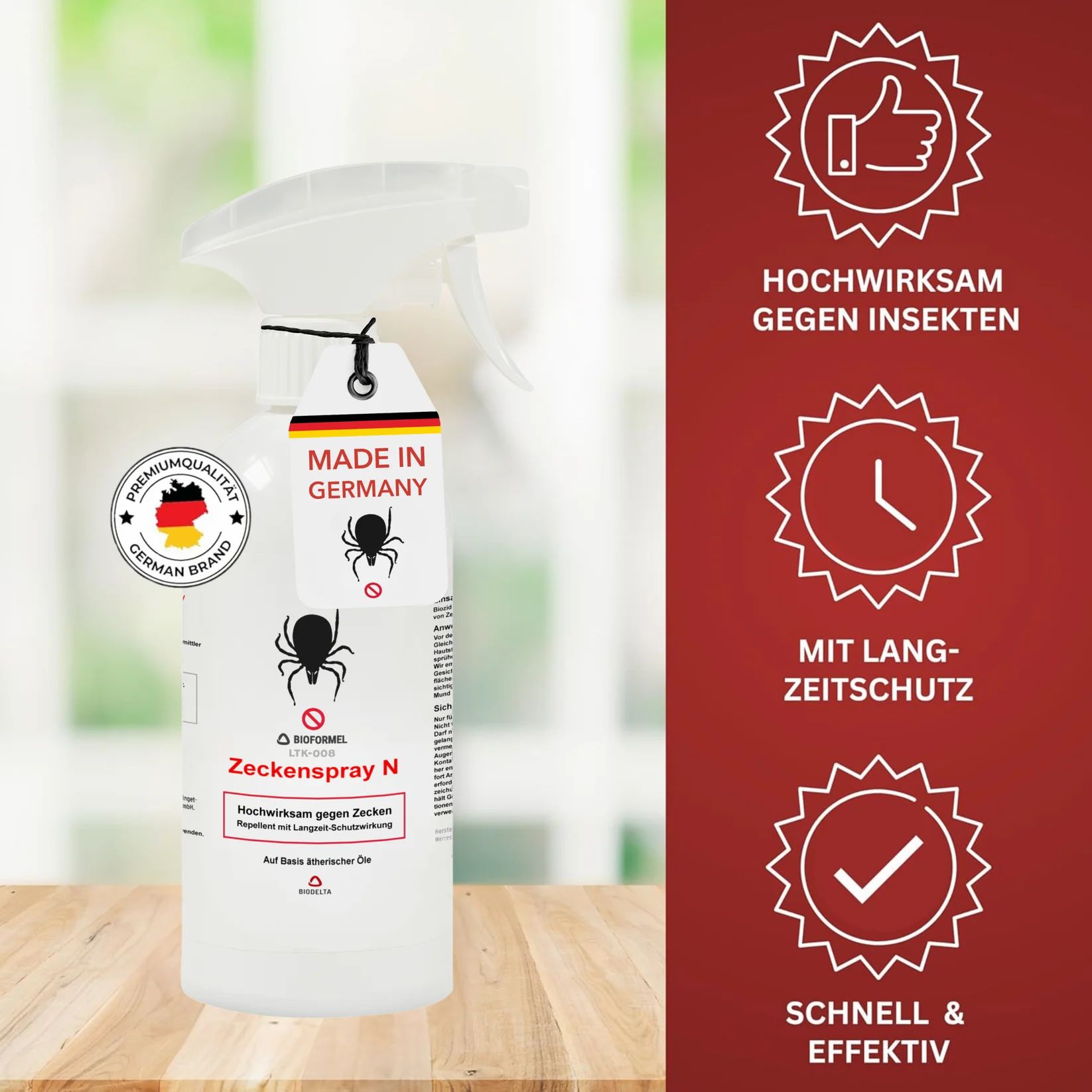 Weißes Spray mit Sprühkopf, Anhänger mit Spinnen-Symbol und Aufschrift "Made in Germany". Logos und Text auf der Flasche.