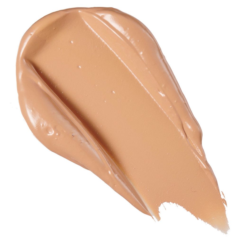 Heller, cremefarbener Concealer-Strich. Glänzende Textur, diagonale Form.