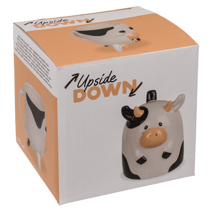 Kuh-Tasse in Verpackung. Weiß, schwarz und beige. Aufdruck "Upside Down".