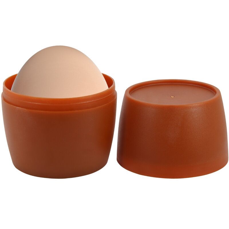 Beige Masturbator in braunem Behälter. Deckel daneben. Zylindrische Form. Material nicht erkennbar.