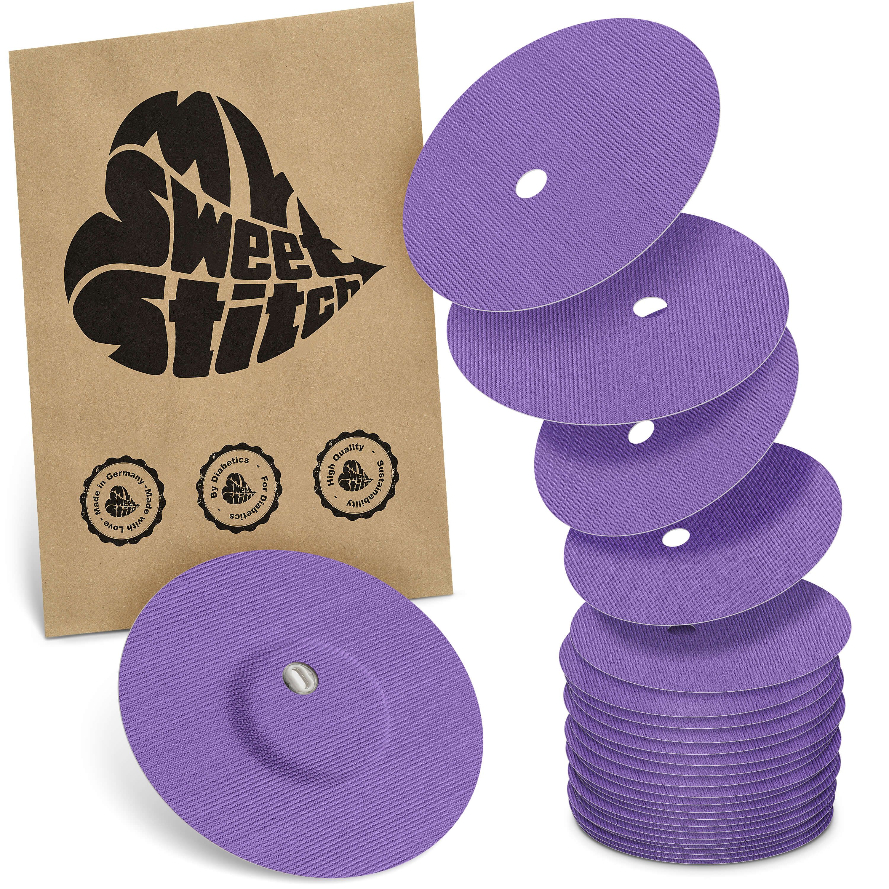 Violette, runde Pflaster mit Belüftungsloch. Einige gestapelt, eines mit Sensor. Braune Verpackung mit Logo und Qualitätssiegeln.
