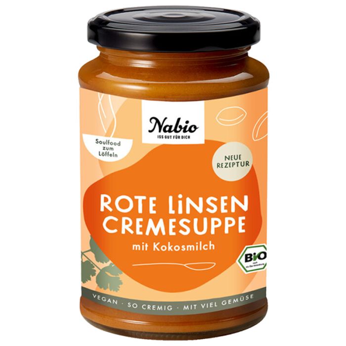 Glas mit Nabio Rote Linsen Cremesuppe mit Kokosmilch. Schwarzer Deckel, orangefarbenes Etikett mit Text und Bio-Siegel.