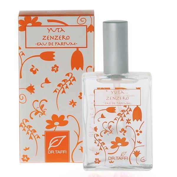 Parfümflasche und Schachtel. Aufschrift: Yuta Zenzero, Eau de Parfum. Orangefarbene florale Muster auf weißem Hintergrund. Marke: Dr. Taffi.