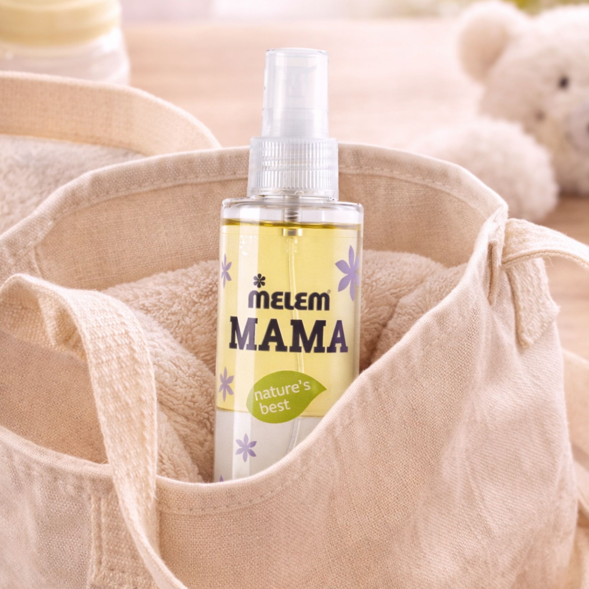 MELEM Mama Bi-Phase Oil in einer Stofftasche mit Handtüchern.