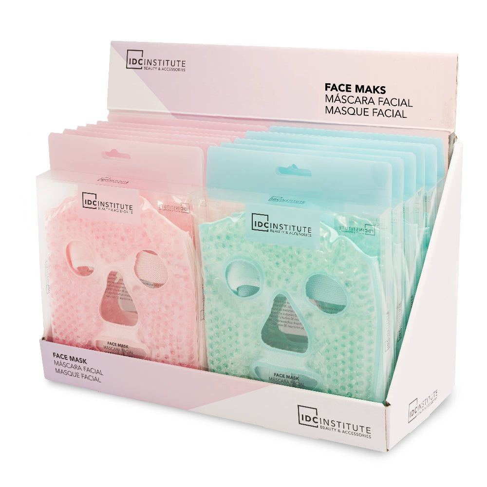 Display mit rosa und grünen Gel-Gesichtsmasken. IDC INSTITUTE Logo. Text: Face Mask. Verpackt in Plastik.