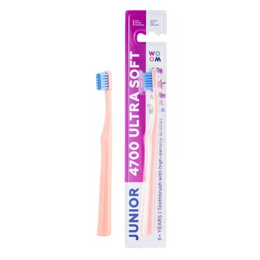 Rosa Zahnbürste und Verpackung. Auf der Verpackung steht 'JUNIOR 4700 ULTRA SOFT'.