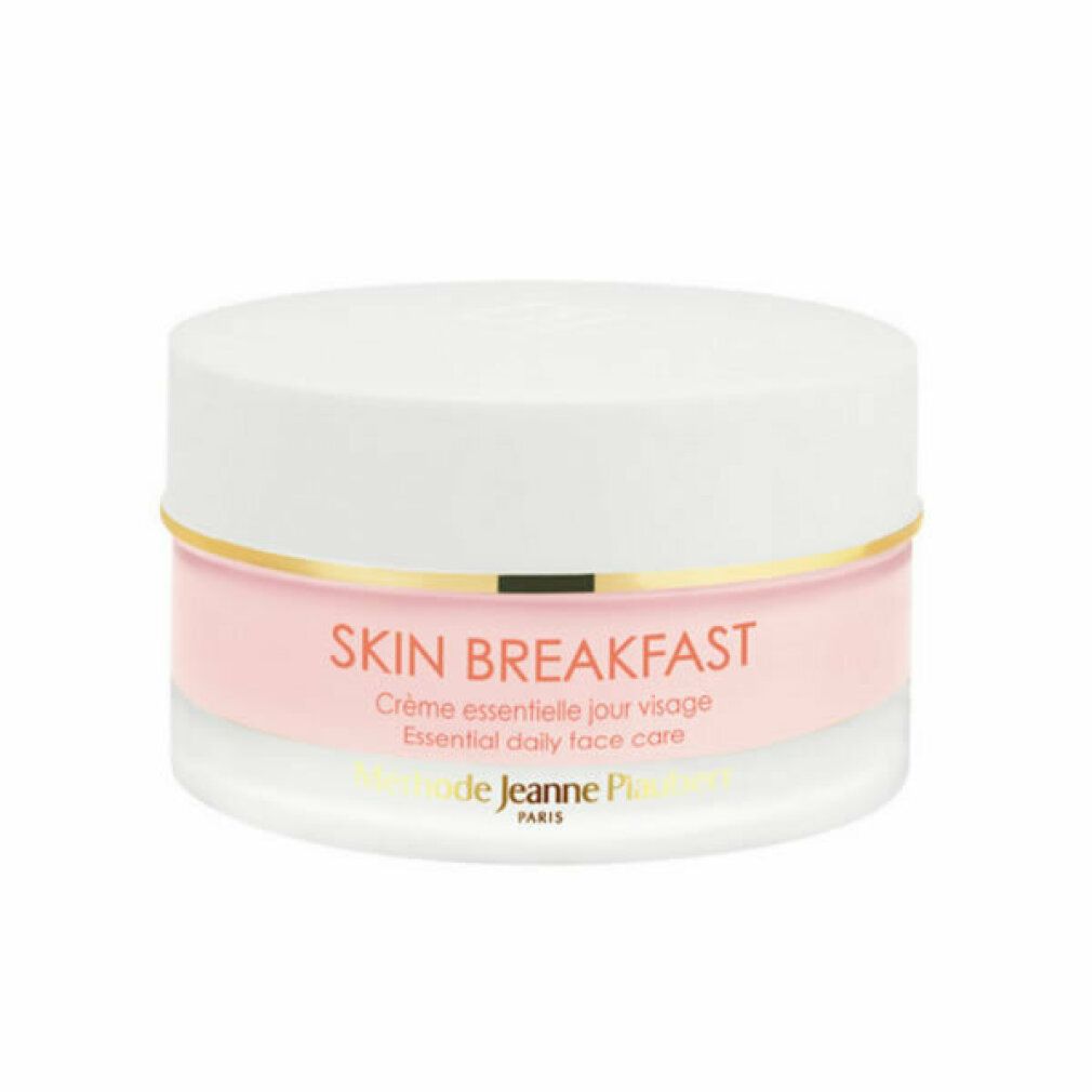 Creme-Tiegel mit weißem Deckel und rosa Inhalt. Goldener Ring. Schriftzug SKIN BREAKFAST.