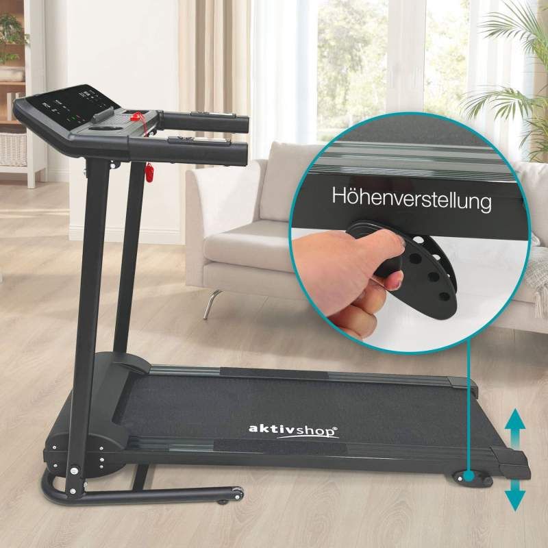 Schwarzes Laufband mit aktivshop-Logo. Nahaufnahme der Höhenverstellung. Hand bedient den Mechanismus.