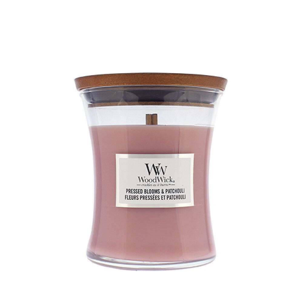 Kerze mit Holzdocht und Deckel. Rosa Wachs in Glasbehälter. Etikett mit Produktnamen und Logo.