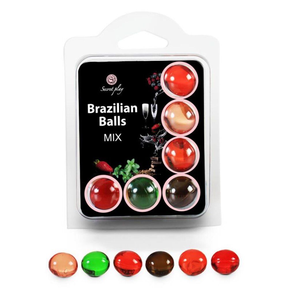 Verpackung mit 6 aromatisierten brasilianischen Kugeln in verschiedenen Farben: rot, rosa, grün und braun. Einzelne Kugeln liegen unter der Verpackung.