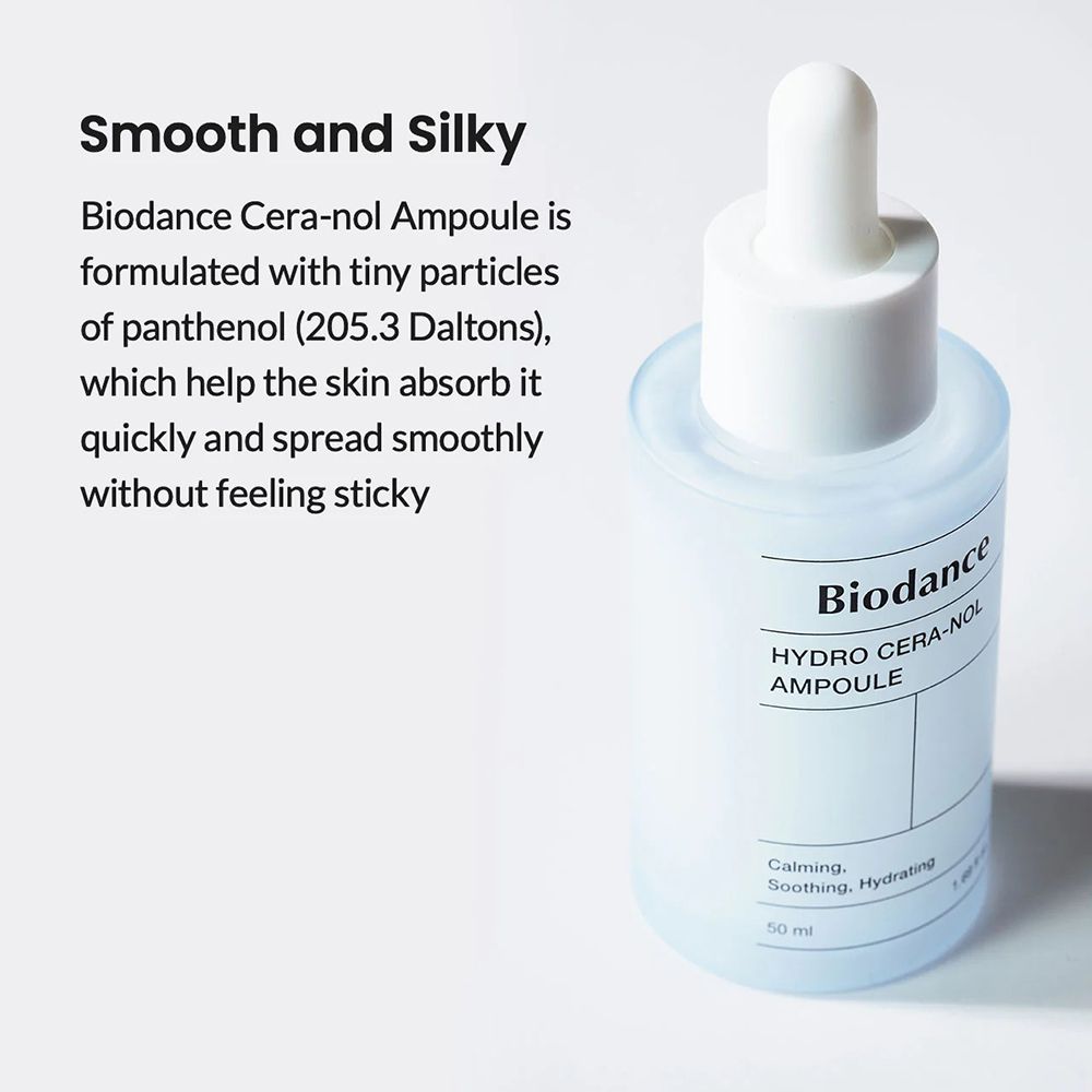 Flasche mit weißem Deckel und Pipette. Aufschrift: Biodance, HYDRO CERA-NOL, AMPULE. Text: Smooth and Silky. Helle Umgebung.
