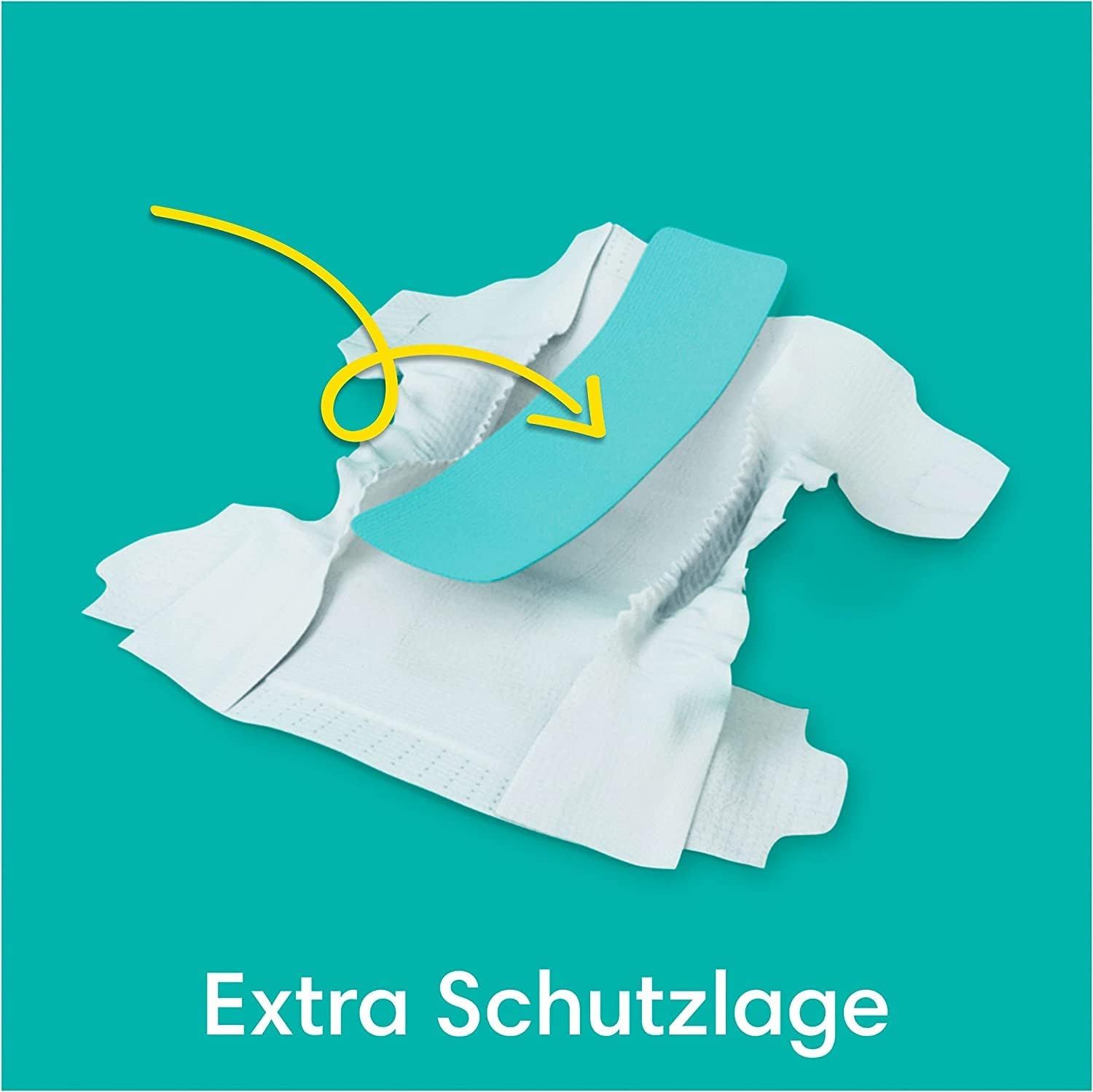 Pampers Baby-Dry Windel mit hervorgehobener blauer Schutzlage. Text: Extra Schutzlage.