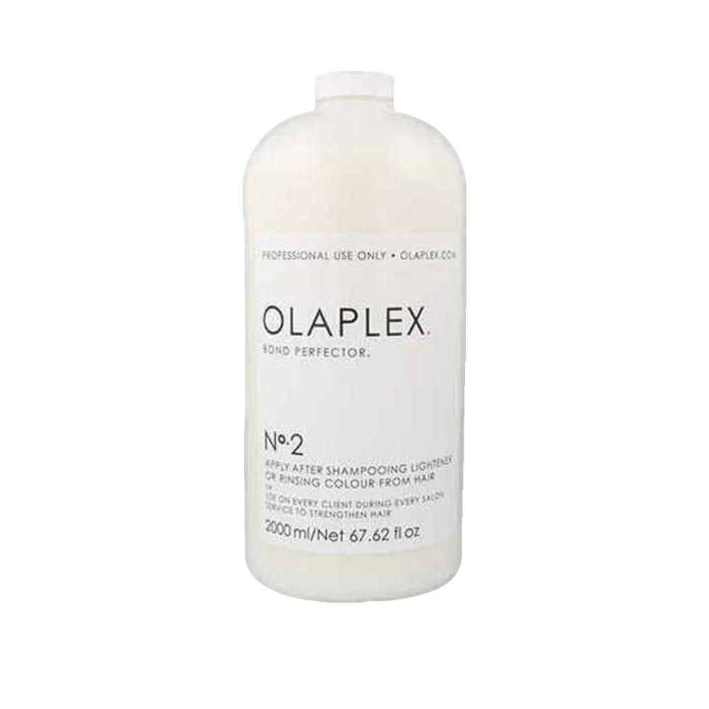 Große, weiße Flasche mit Etikett. Aufschrift: OLAPLEX Bond Perfector N°2. Volumen: 2000 ml.
