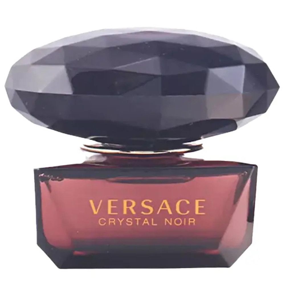 Versace Crystal Noir Flakon. Dunkelbraune, facettierte Kappe. Aufschrift Versace Crystal Noir.