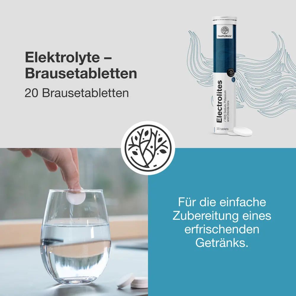 Eine Brausetablette löst sich in einem Glas Wasser auf, daneben eine Packung Elektrolyt-Brausetabletten.