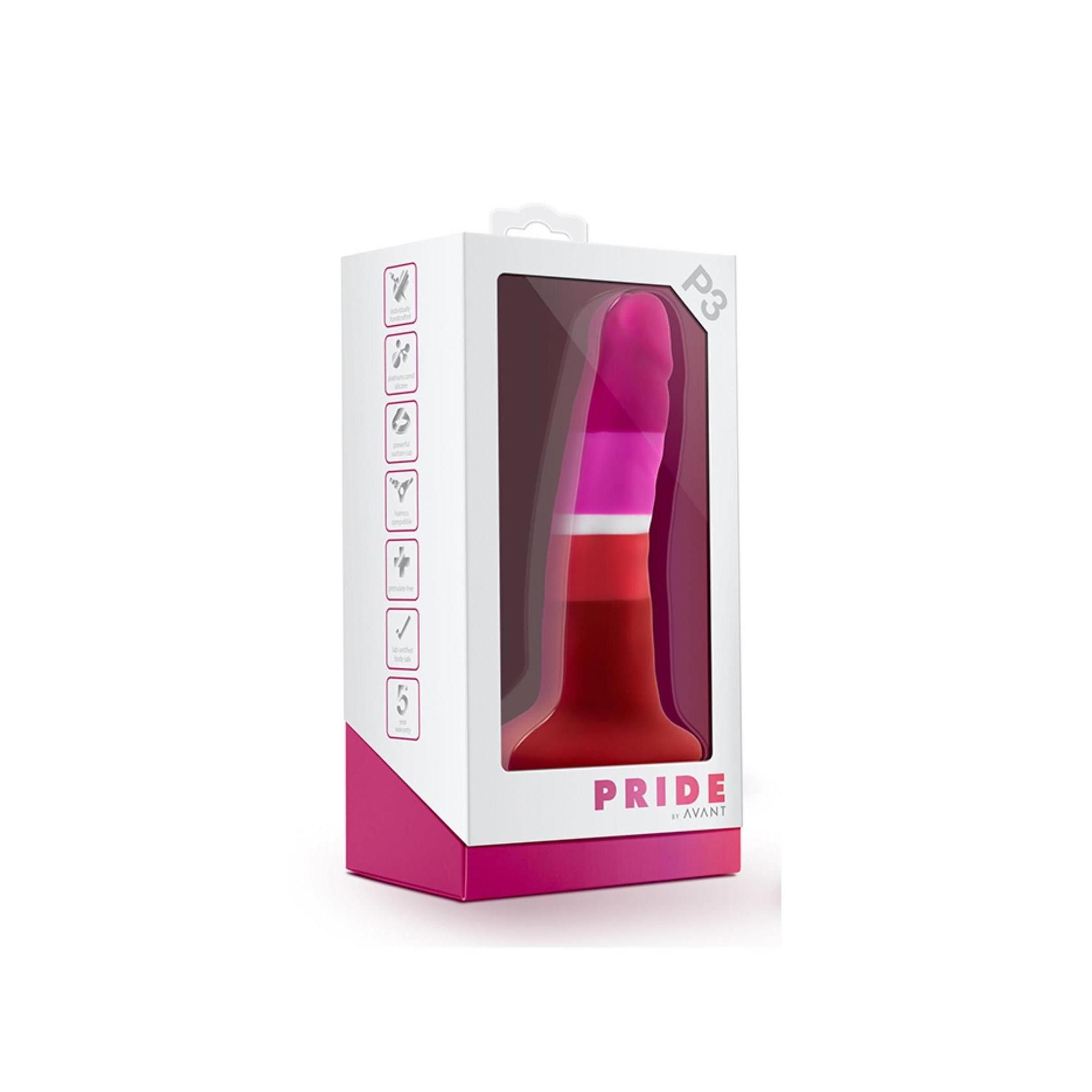 Dildo in Verpackung. Farben: Pink, Weiß, Orange und Rot. Verpackung mit Sichtfenster. Text: "PRIDE AVANT".