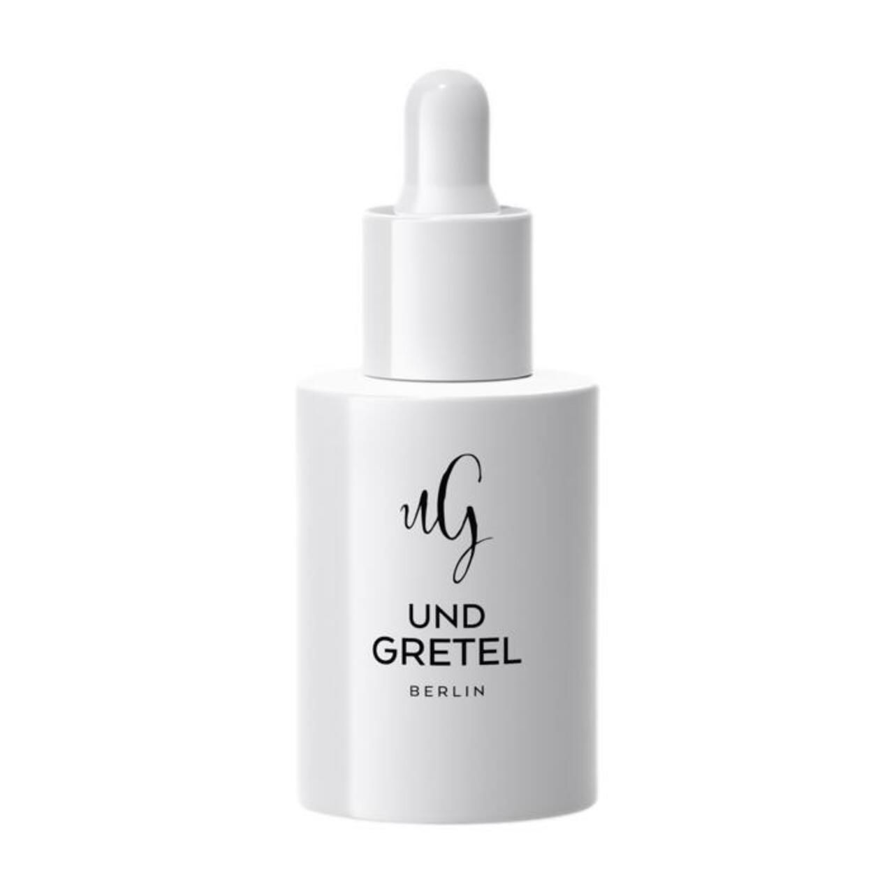 Weiße Flasche mit Tropfer. Schriftzug: UND GRETEL BERLIN. Schwarze Schrift auf der Flasche.