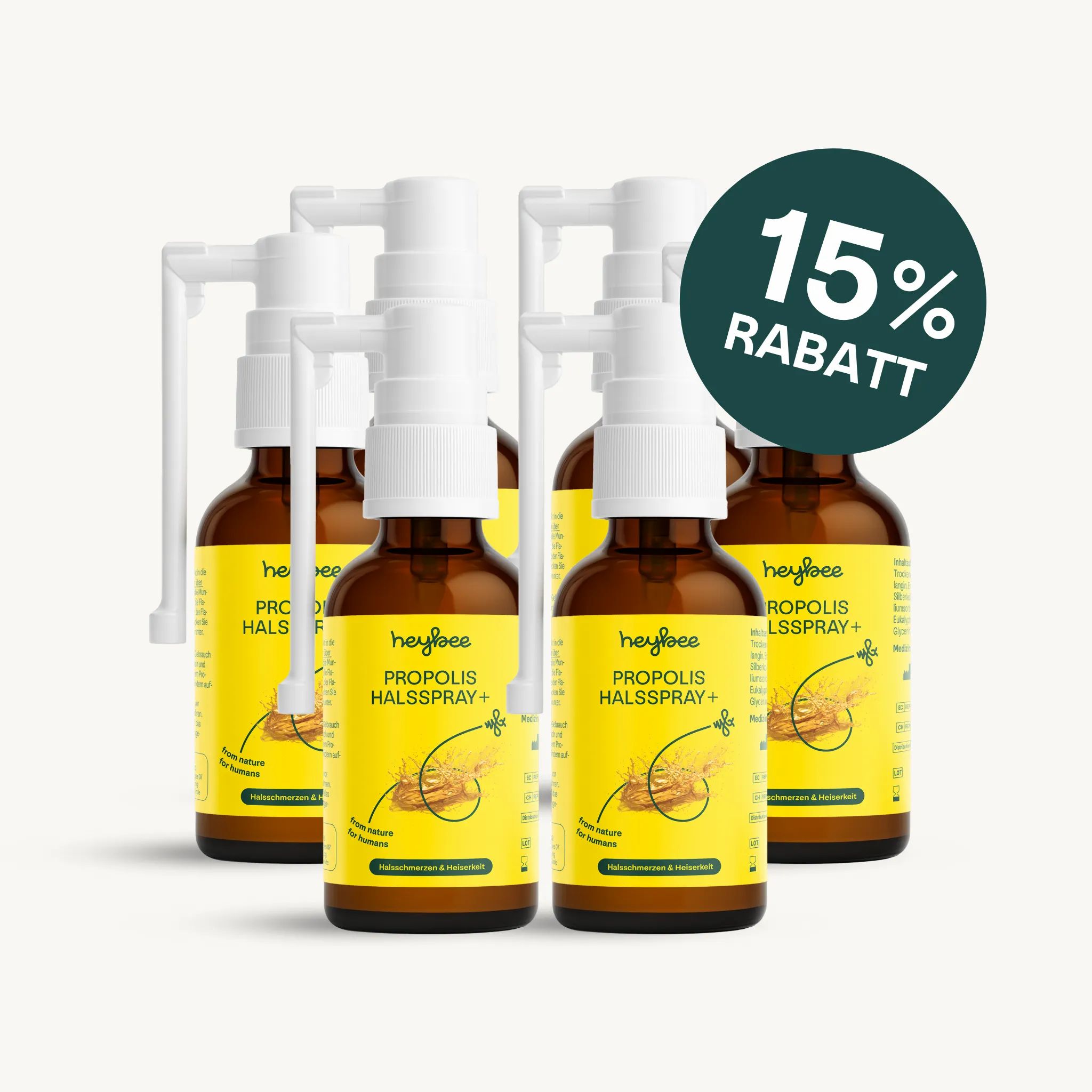 Fünf Flaschen heybee PROPOLIS HALSSPRAY+ mit weißem Sprühkopf. 15% Rabatt-Label.