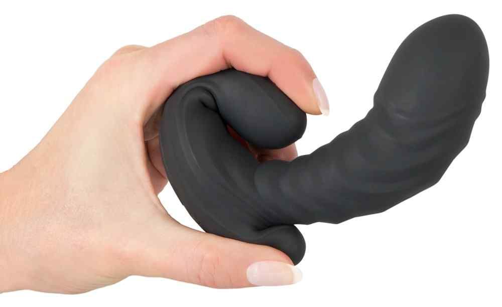 Hand hält einen schwarzen, flexiblen G&P-Spot-Vibrator.