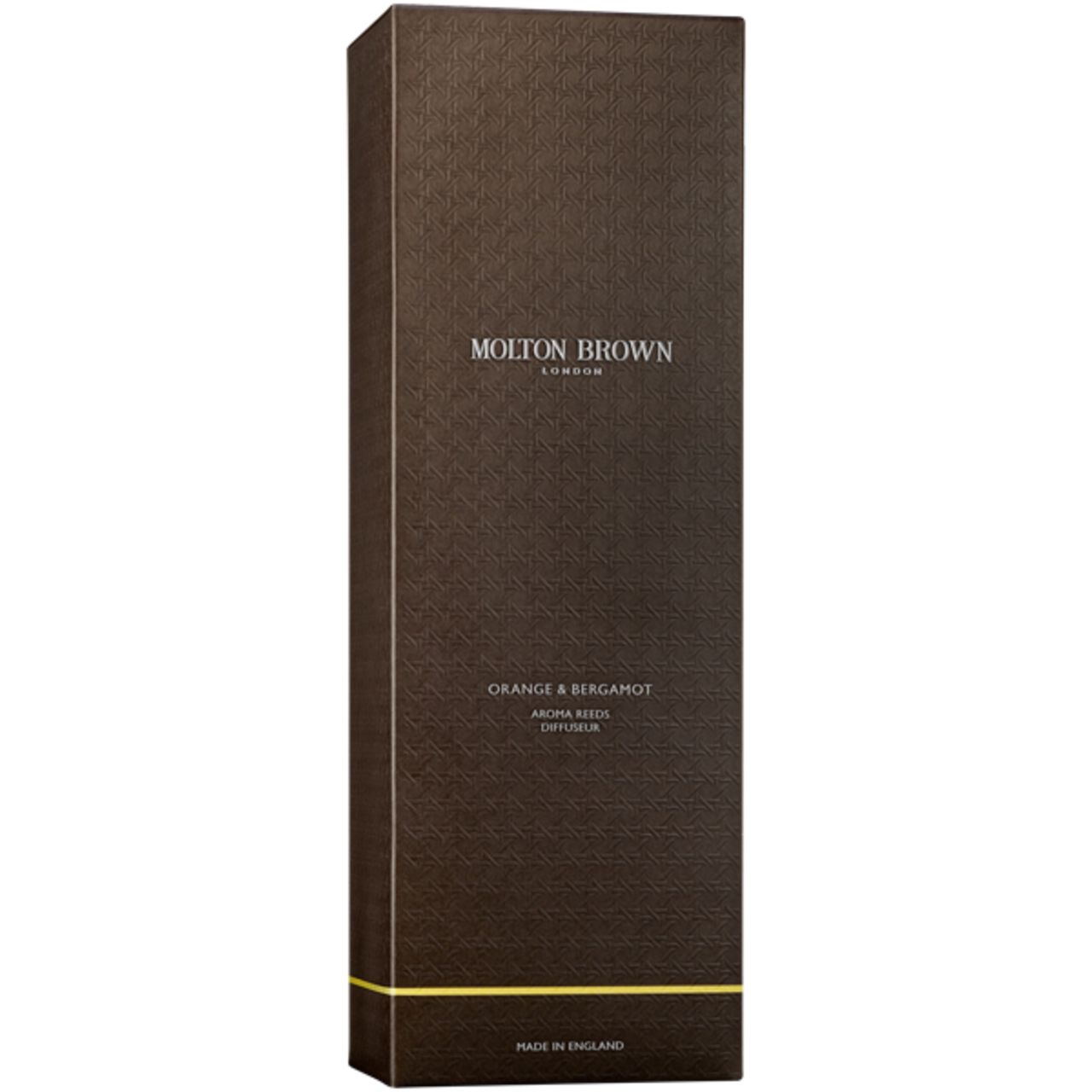 Braune Verpackung mit Aufschrift Molton Brown, Orange & Bergamot. Gelbe Linie am unteren Rand. Hergestellt in England.