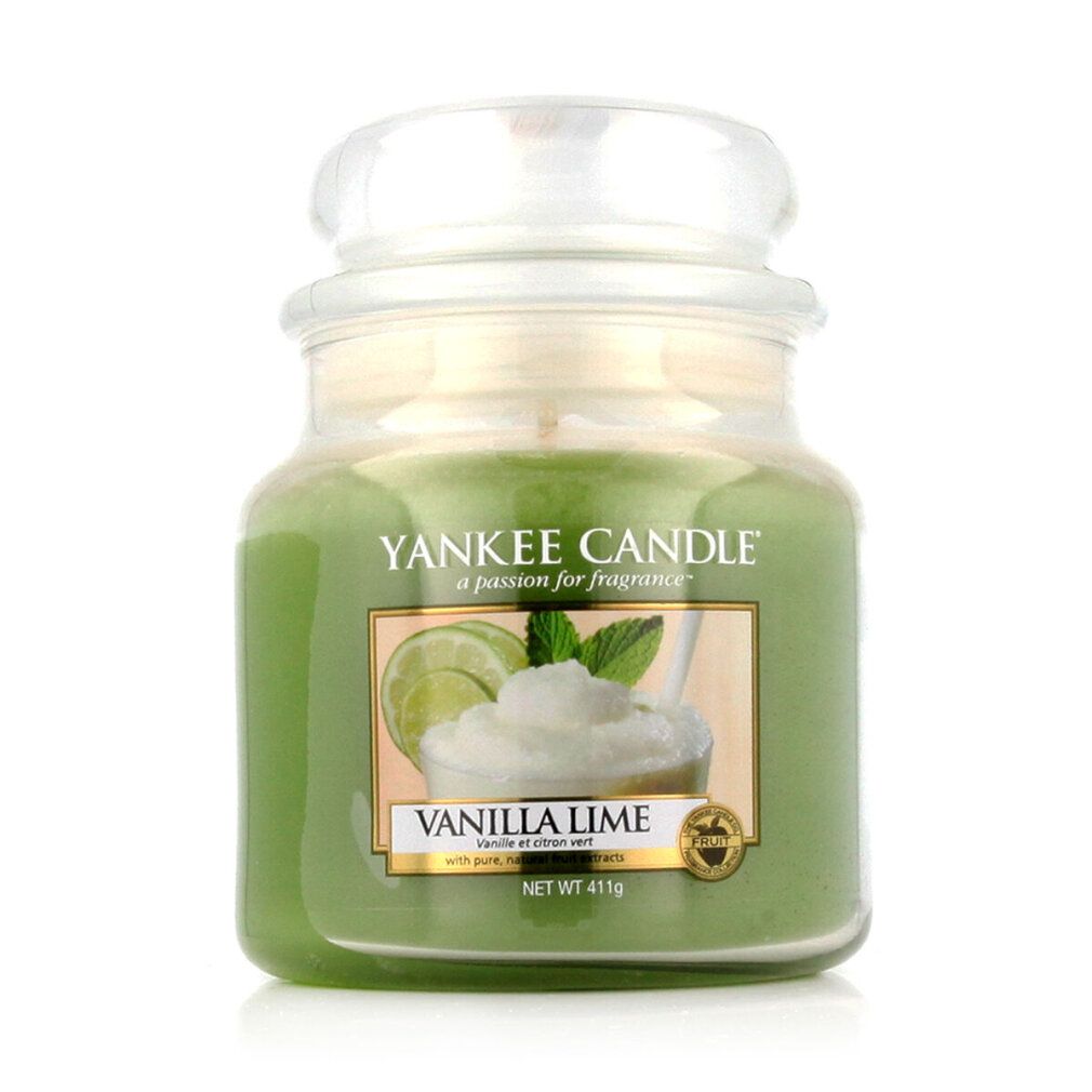 Grüne Kerze im Glas mit Deckel. Etikett mit Limetten- und Vanille-Motiv. Aufschrift: Vanilla Lime. Glasbehälter.