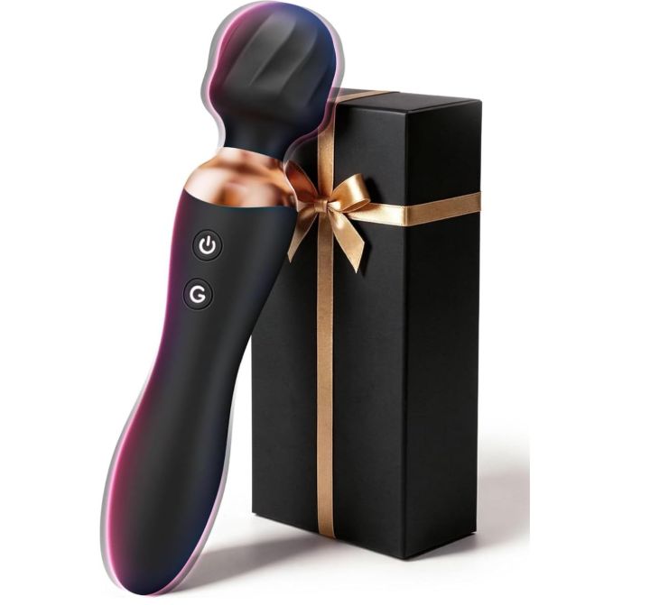Schwarzer Vibrator mit kupferfarbenen Akzenten, neben einer schwarzen Geschenkbox mit goldenem Band.