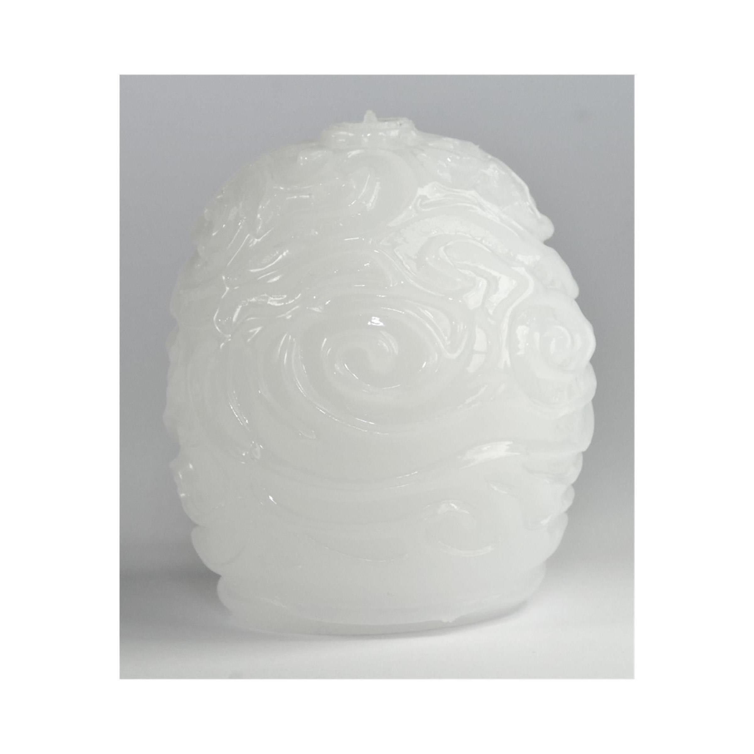 Weißes, eiförmiges Produkt mit reliefartigen Wirbelmustern. Keine weitere Beschriftung sichtbar.