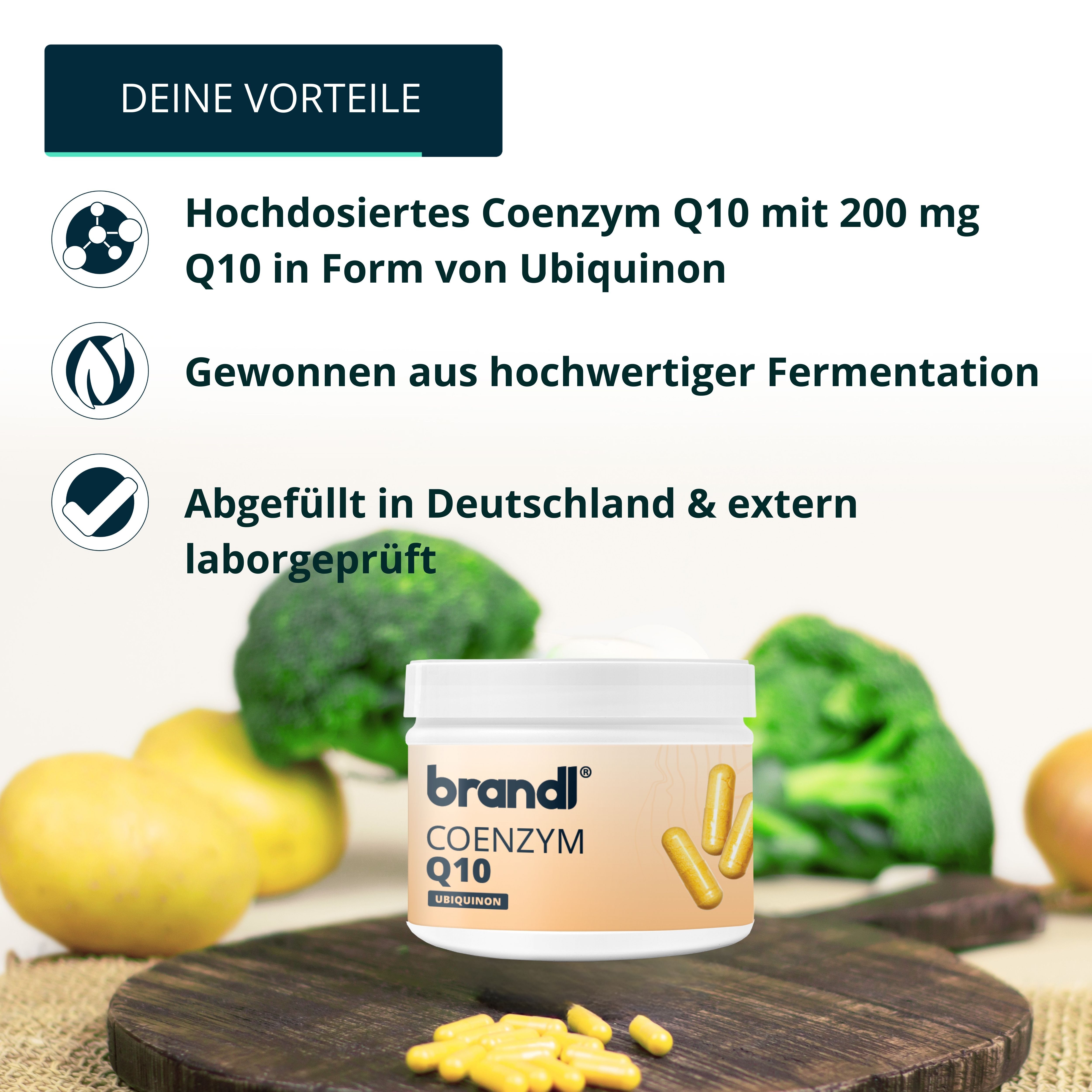 Holzbrett mit Gemüse und Dose mit Coenzym Q10 Kapseln. Marke: brandl. Text: 200 mg Q10, laborgeprüft.