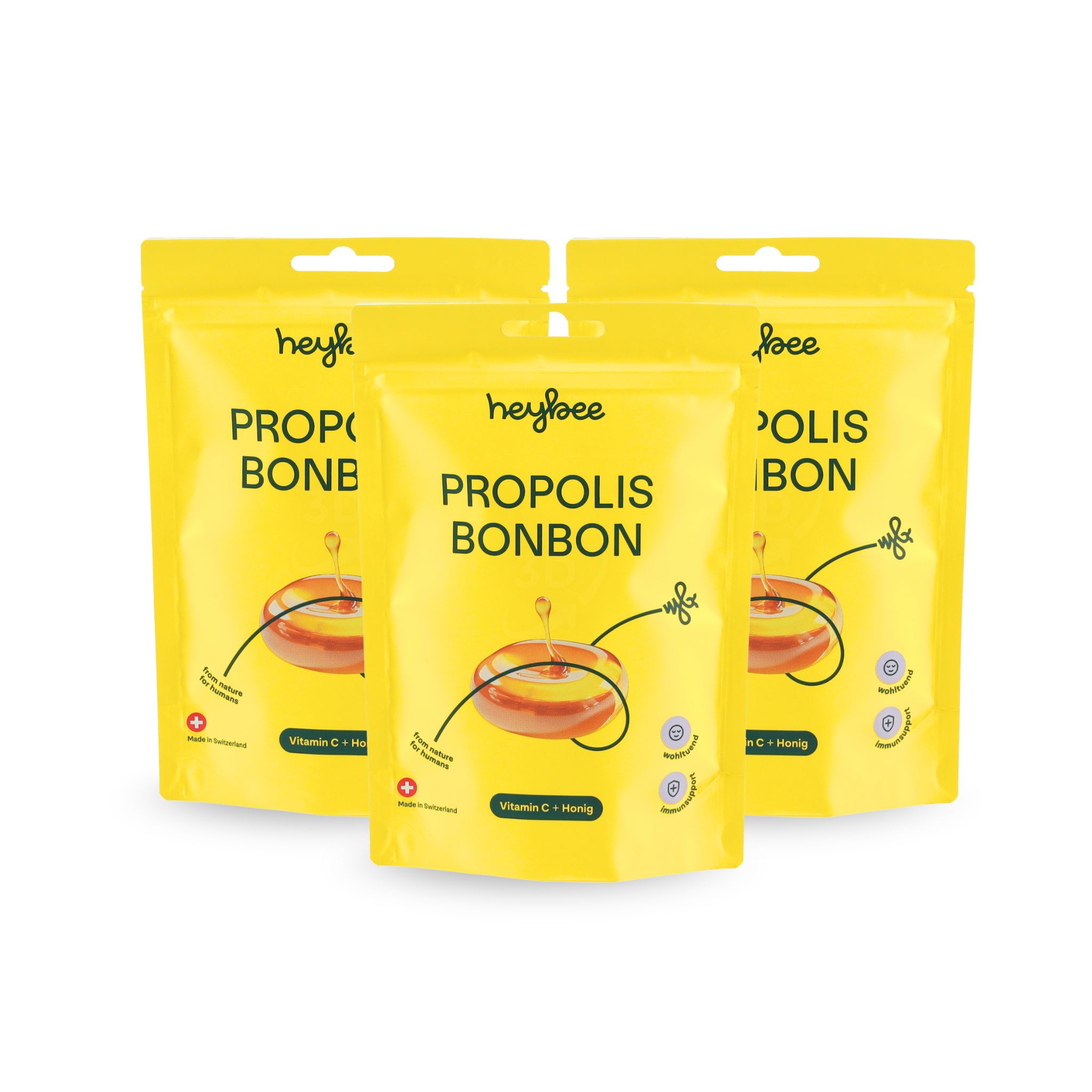Drei gelbe Verpackungen von heybee Propolis Bonbon. Text: Propolis Bonbon, Vitamin C + Honig. Apotheken Qualität.