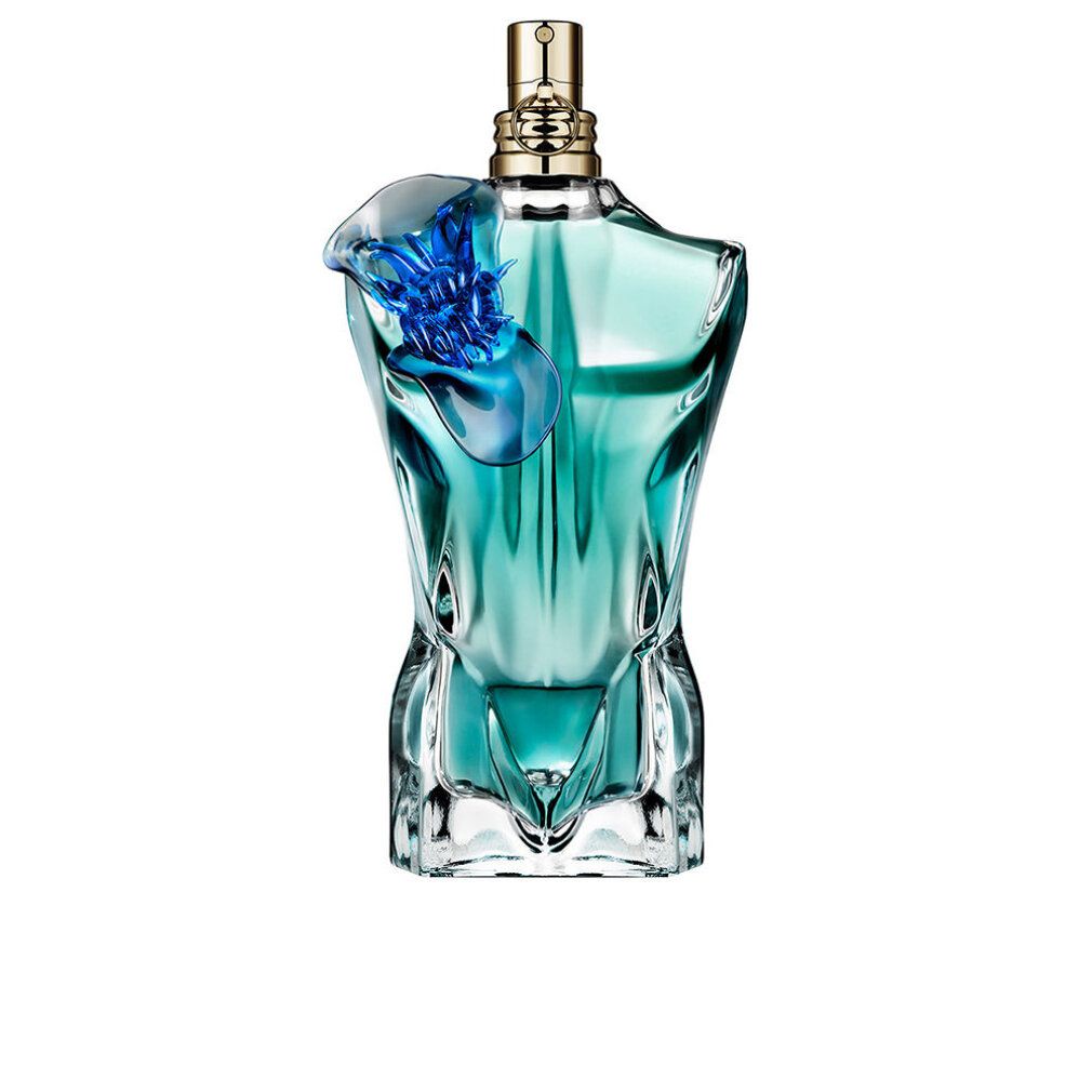 Türkisgrüner Flakon in Torsoform mit goldfarbenem Verschluss und blauer Blume. Auf weißem Hintergrund.