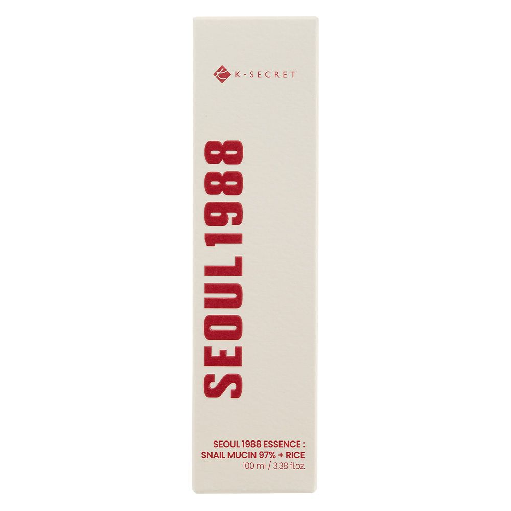 K-SECRET Seoul 1988 Essence Kartonverpackung. Beige Schachtel mit rotem Schriftzug.