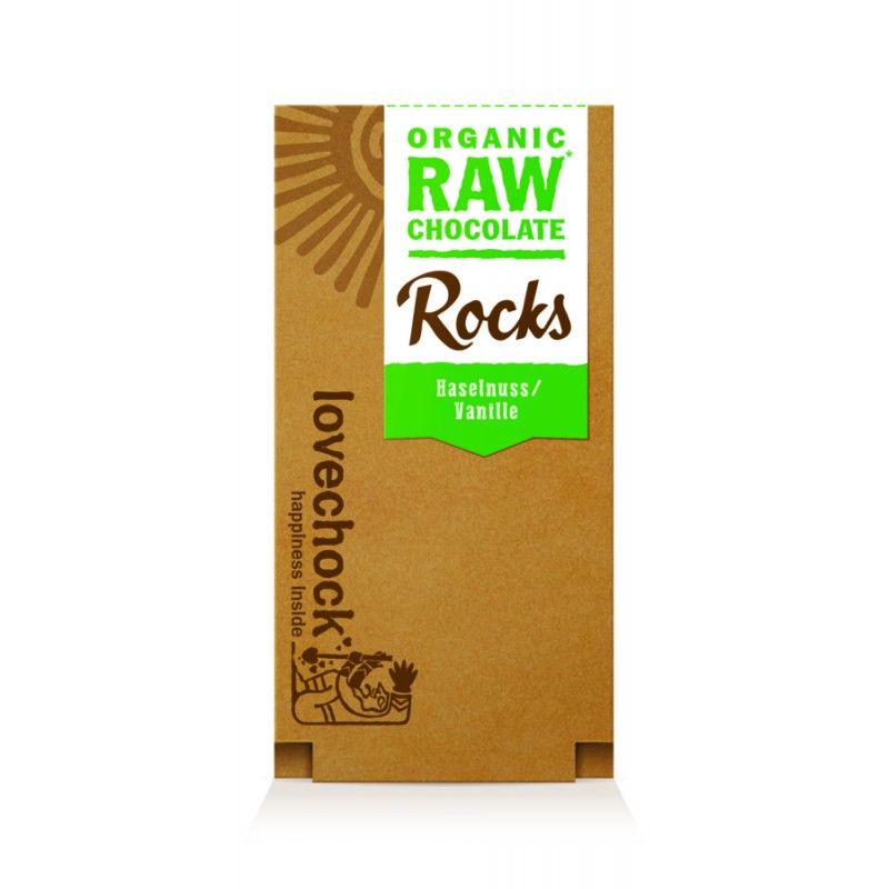 Braune Verpackung mit grünem Etikett. Aufschrift: "ORGANIC RAW CHOCOLATE Rocks Haselnuss/Vanille". Marke: Lovechock.