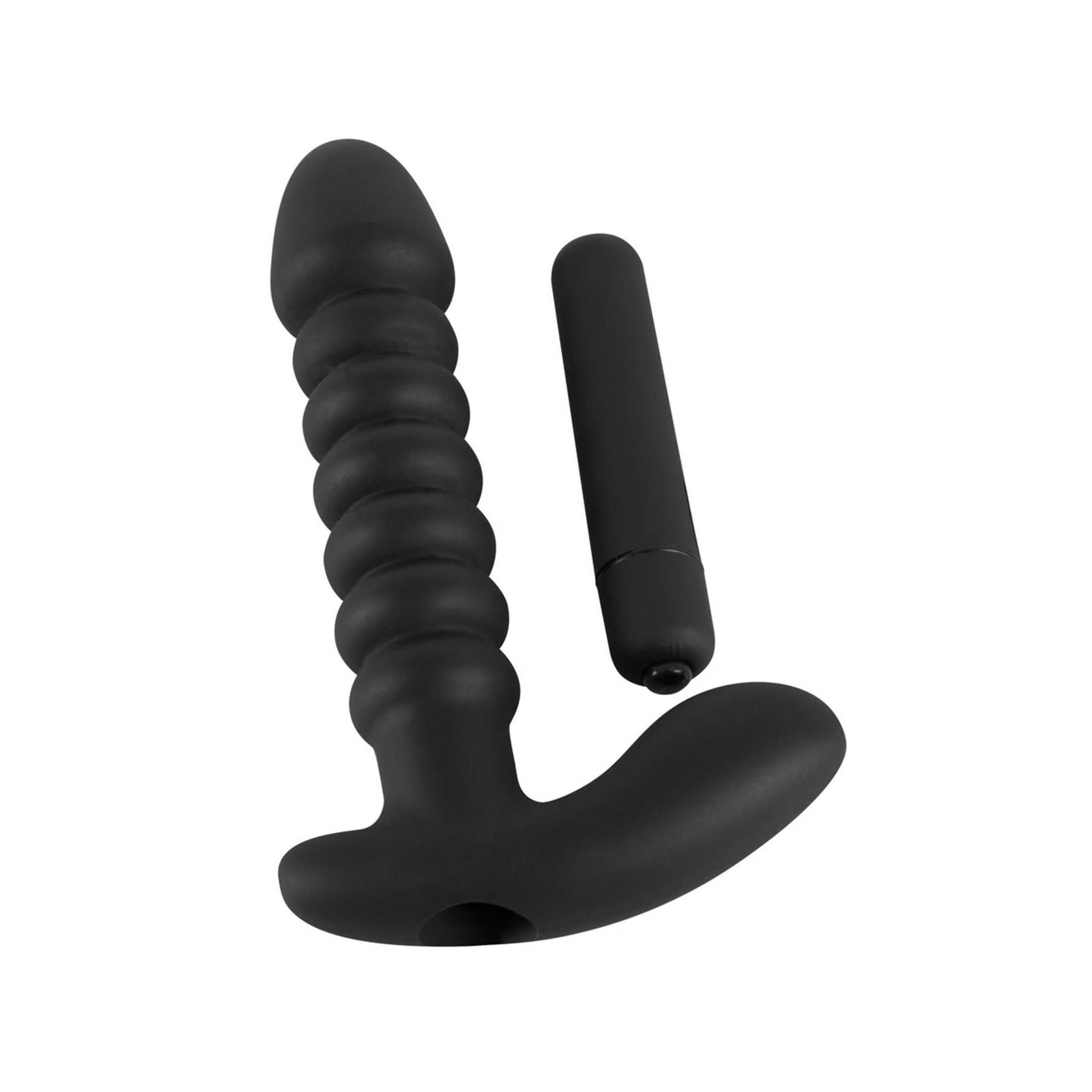 Schwarzer Vibrations-Plug und kleiner Vibrator. Geriffelte Oberfläche, T-Form. Auf hellem Hintergrund.