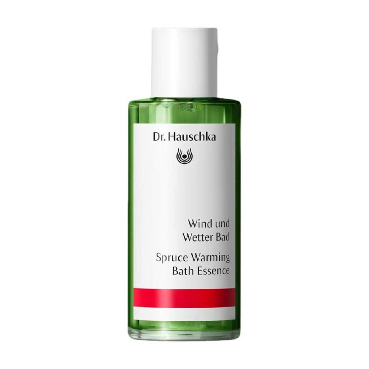 Grüne Glasflasche mit weißem Deckel. Etikett mit Schriftzug 'Dr. Hauschka' und 'Wind und Wetter Bad'. Roter Streifen.