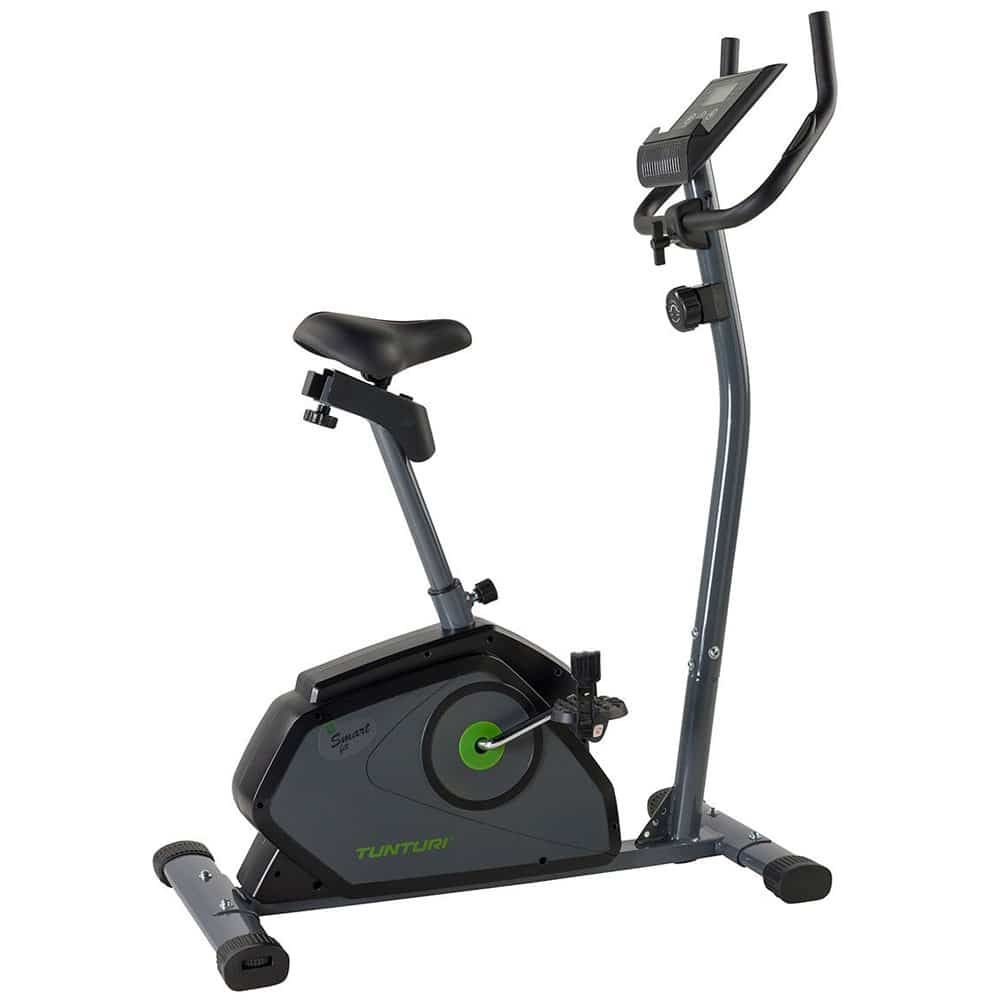 Ergometer. Grau-schwarzes Fahrrad mit Sattel, Lenker und Display. Tunturi-Logo. Grün-schwarzes Gehäuse. Pedale und Stützfüße.