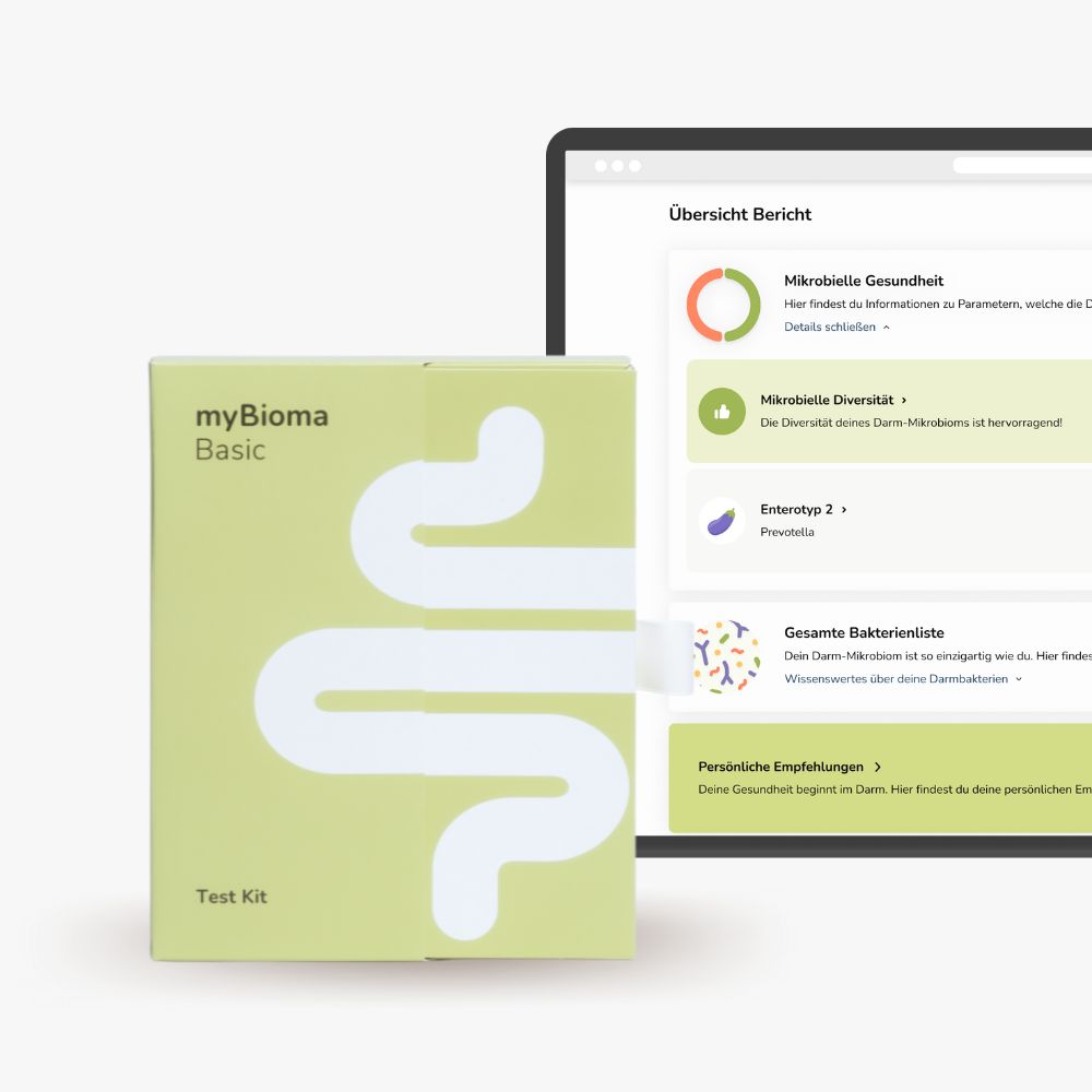 Hellgrüne Schachtel neben Computerbildschirm. Bildschirm zeigt Bericht zur Darmgesundheit.