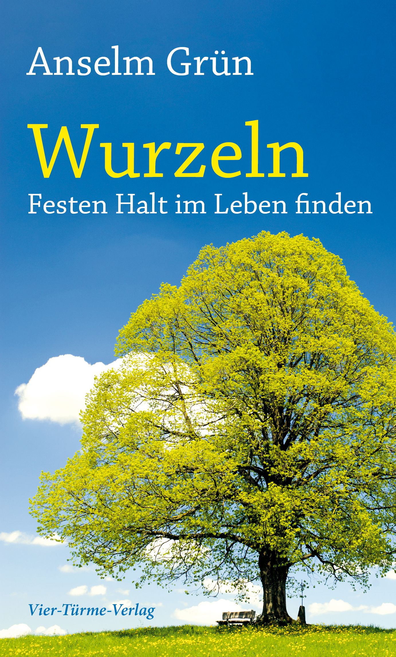 Buchcover mit blauem Himmel und Baum. Titel: Wurzeln. Autor: Anselm Grün. Verlag: Vier-Türme-Verlag. Gelbe Schrift auf blauem Hintergrund.